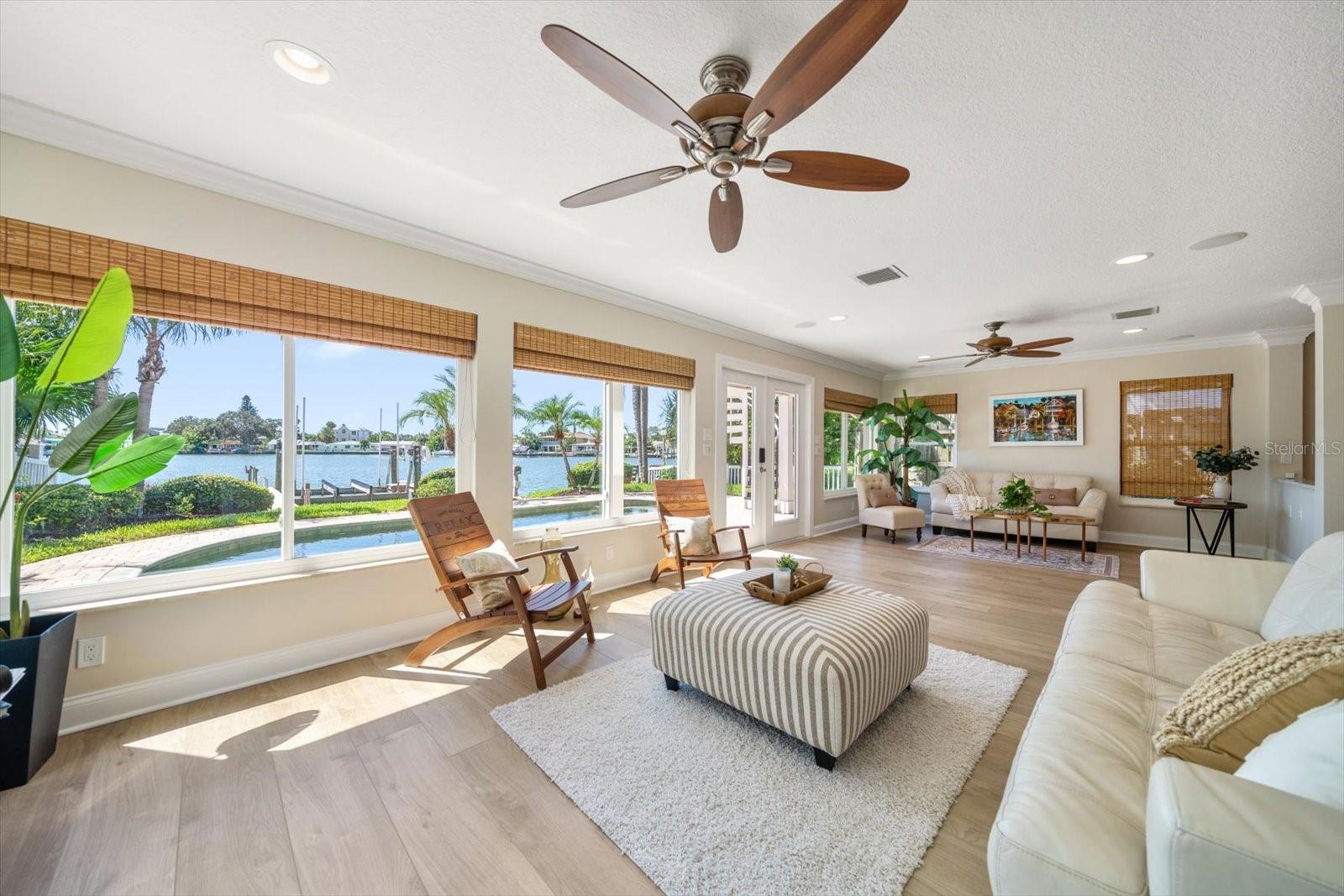 Serene water views are framed from the grand living area.