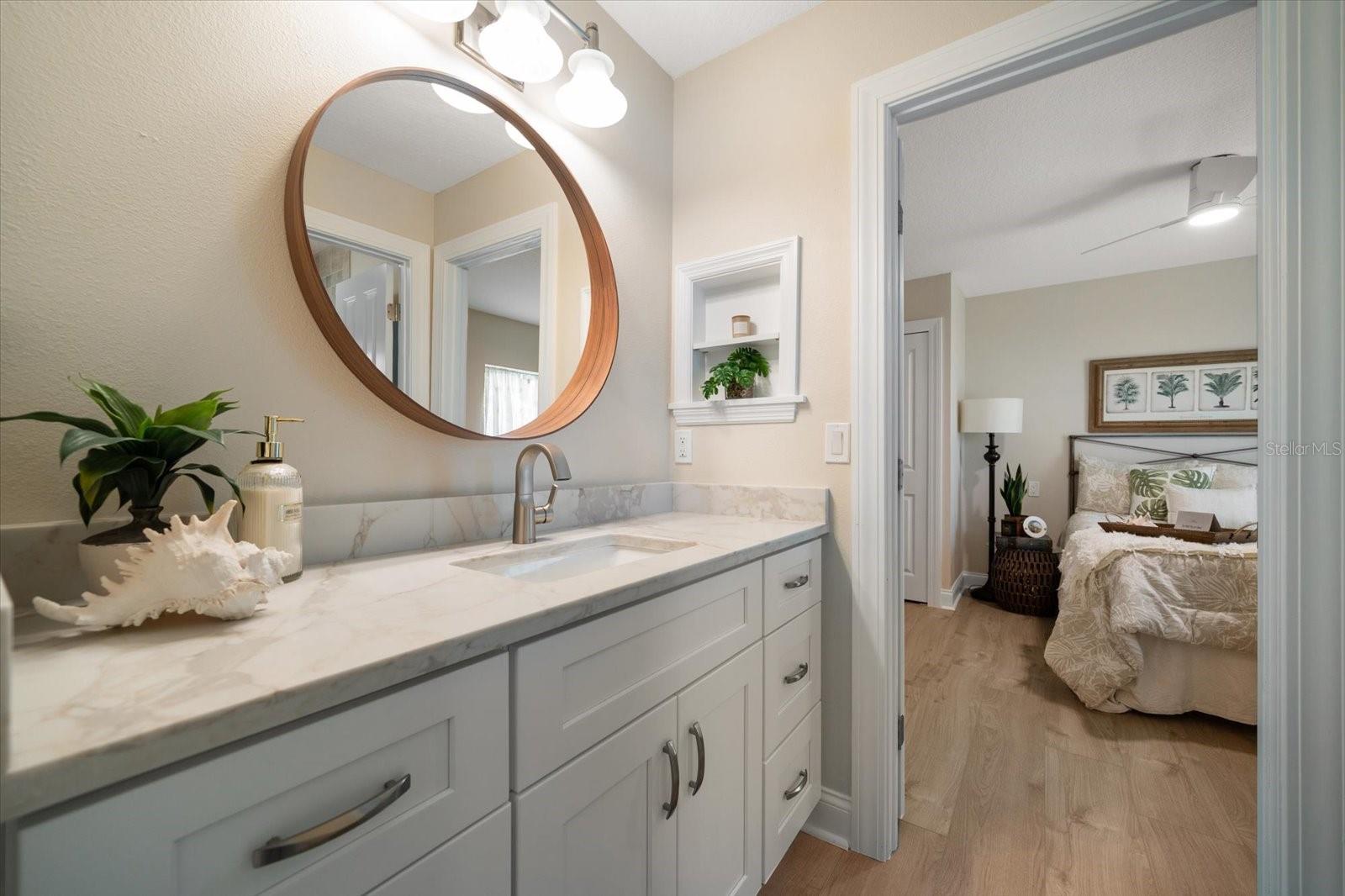 Full bath room services guest bedrooms on main level.