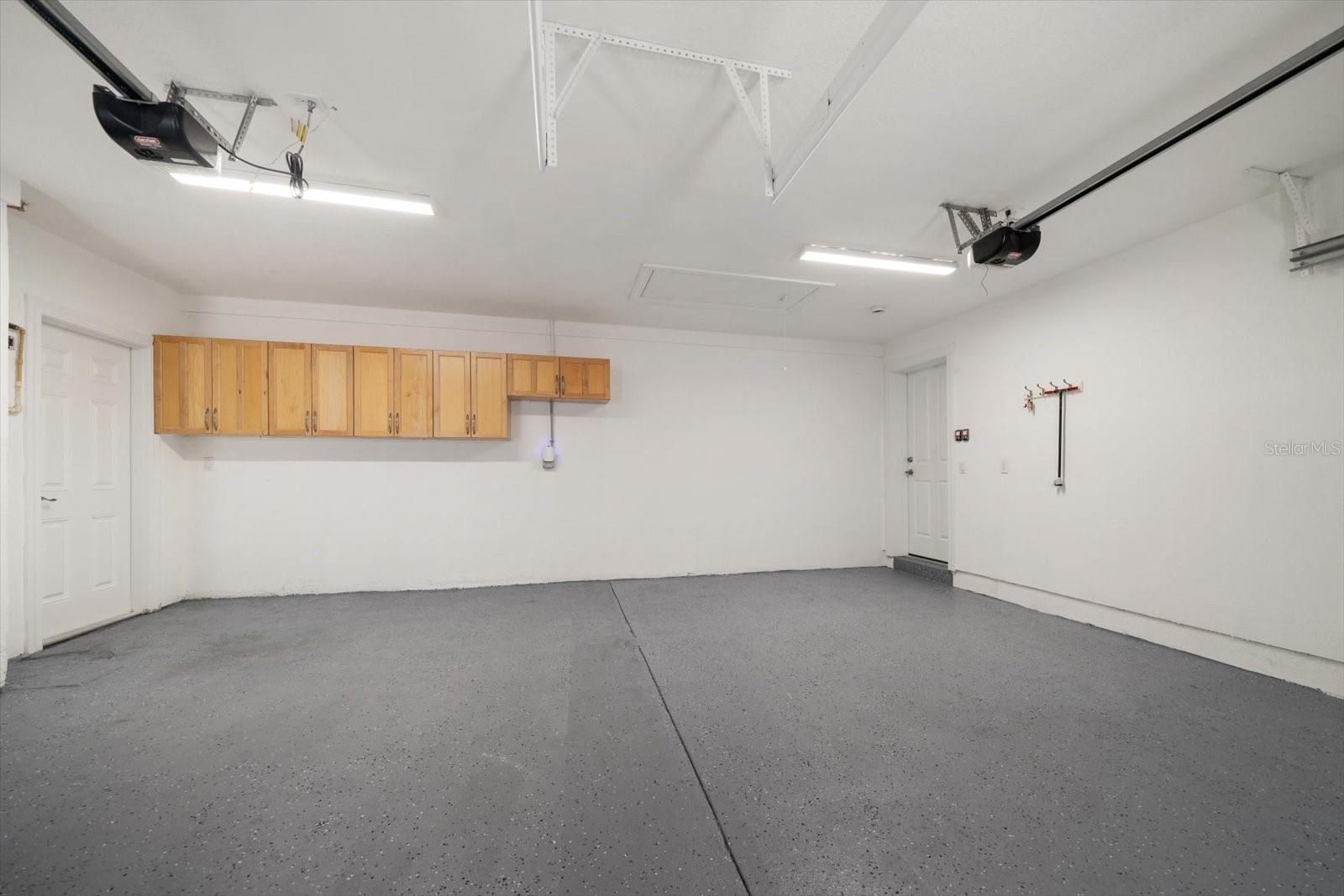 Oversized 2 car garages with access to finished storage in attic area