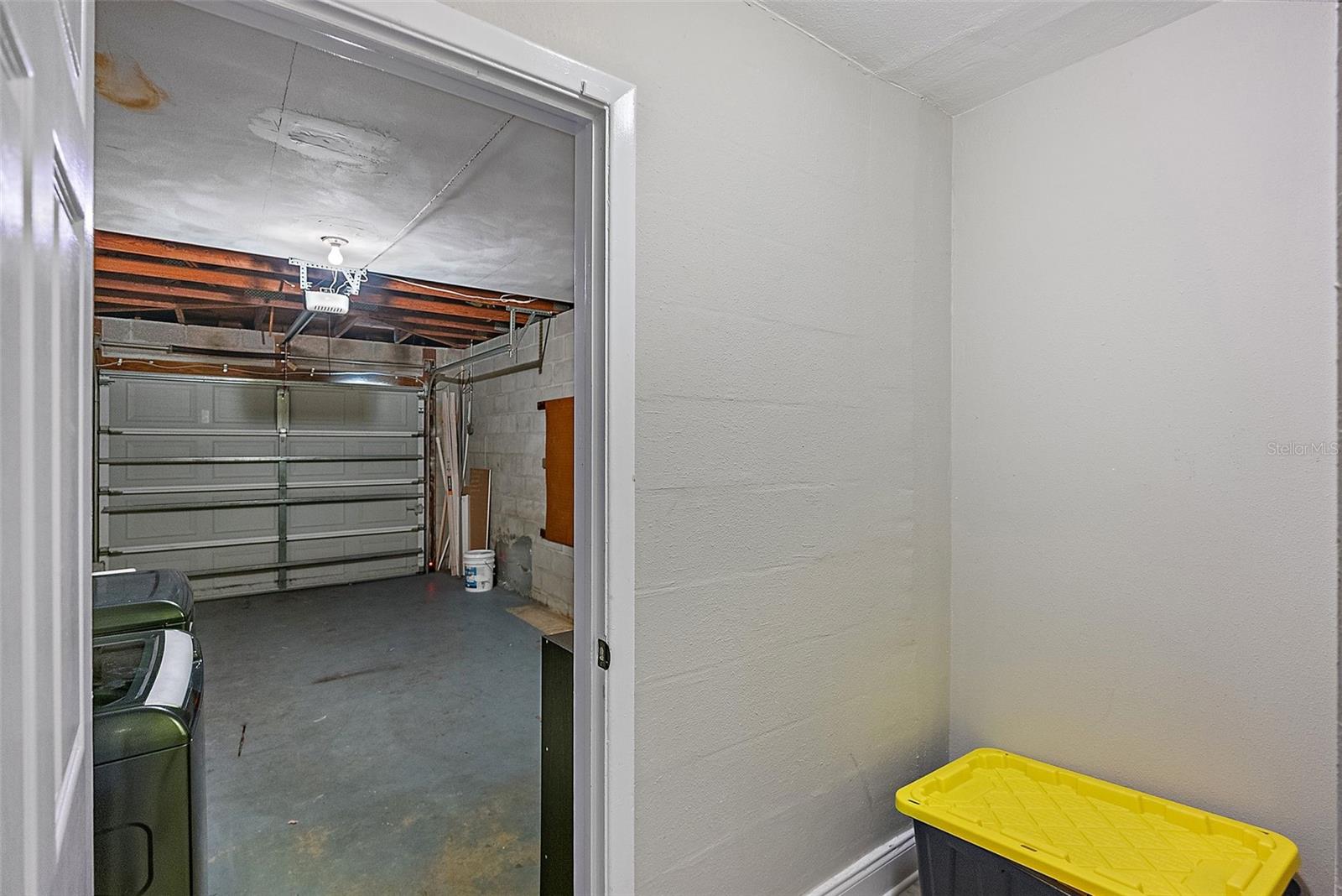 Additional storage off garage (A/C location)