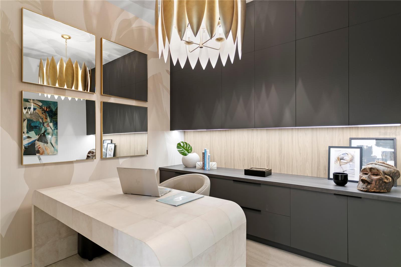 Designer office complete with file cabinets, printer cabinet, upper cabinets that extend to the ceiling providing an abundance of storage.