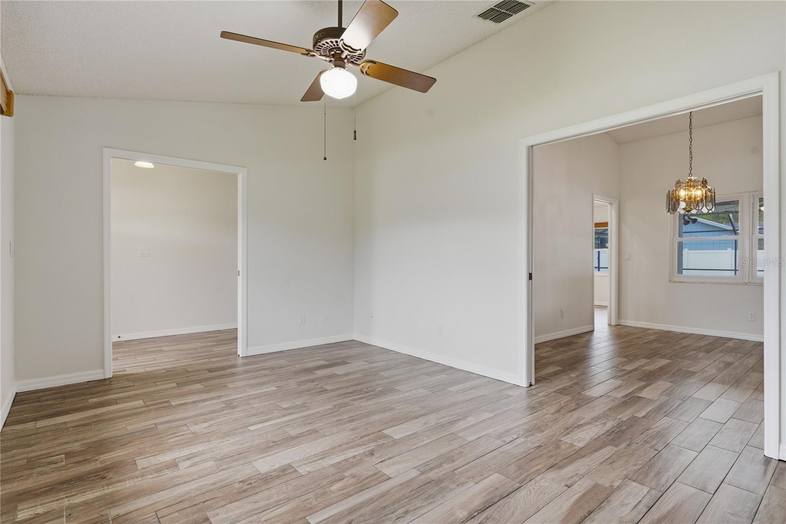 Living Room and Formal Dining Room View 1