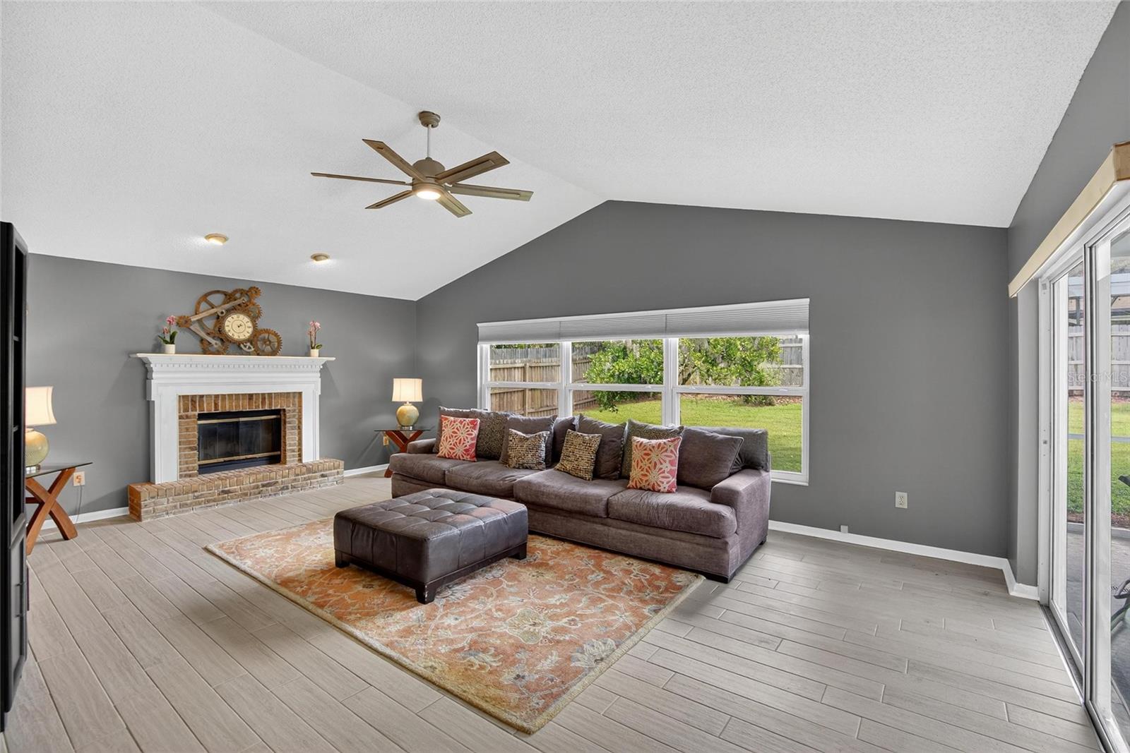 FAMILY ROOM WITH WOOD BURING FIRE PLACE