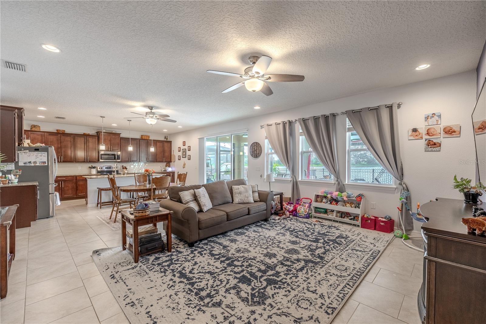 Inviting family room filled with natural light and plenty of space for comfortable everyday living.