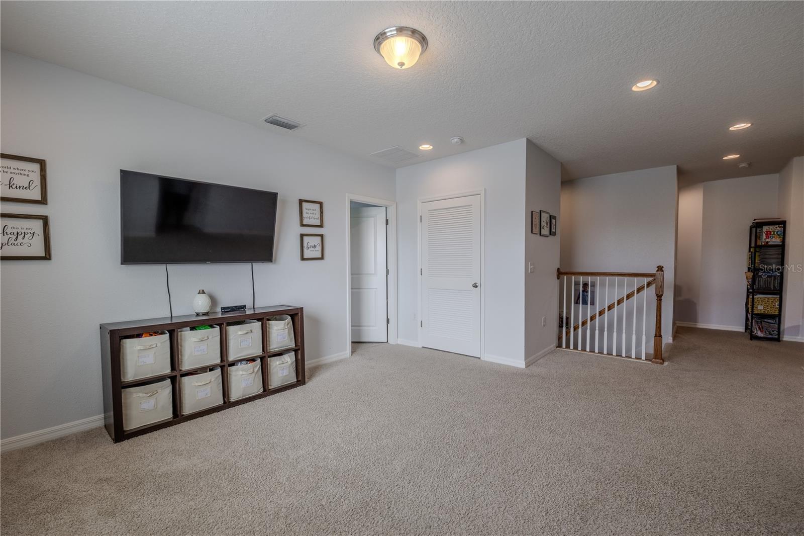 Expansive upstairs bonus space, ideal for a media lounge, play area, or home office with room to spread out.