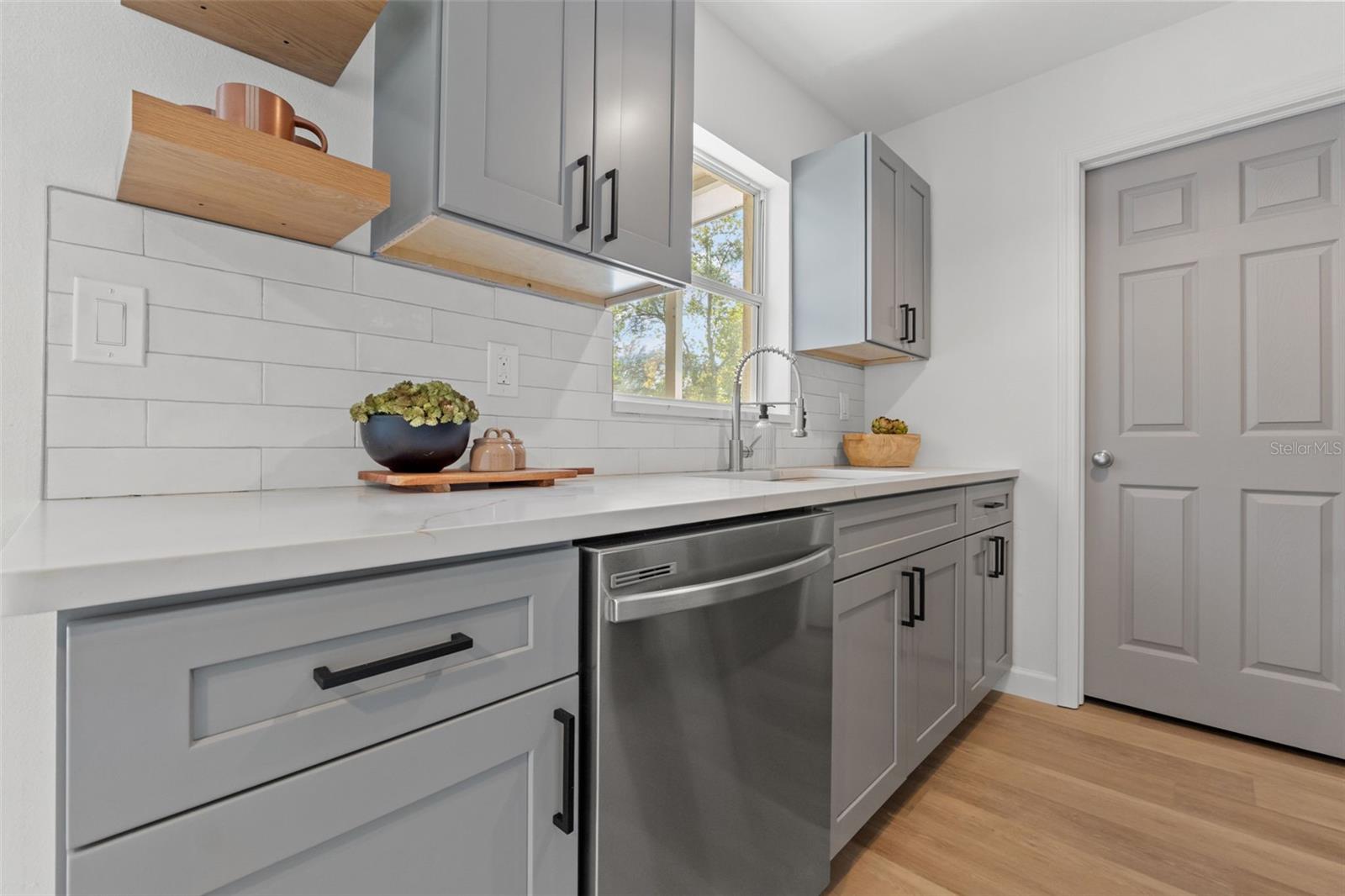 New kitchen cabinets, appliances and backsplash