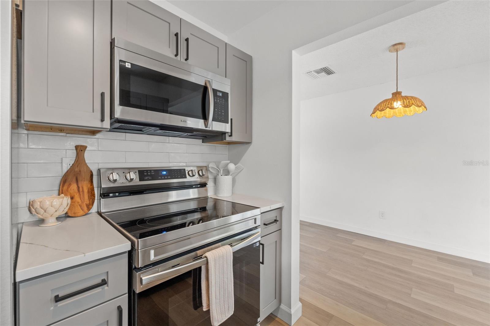 New kitchen cabinets, appliances and backsplash