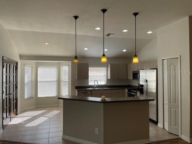Kitchen with Breakfast Nook and Double Doors to Bonus Room