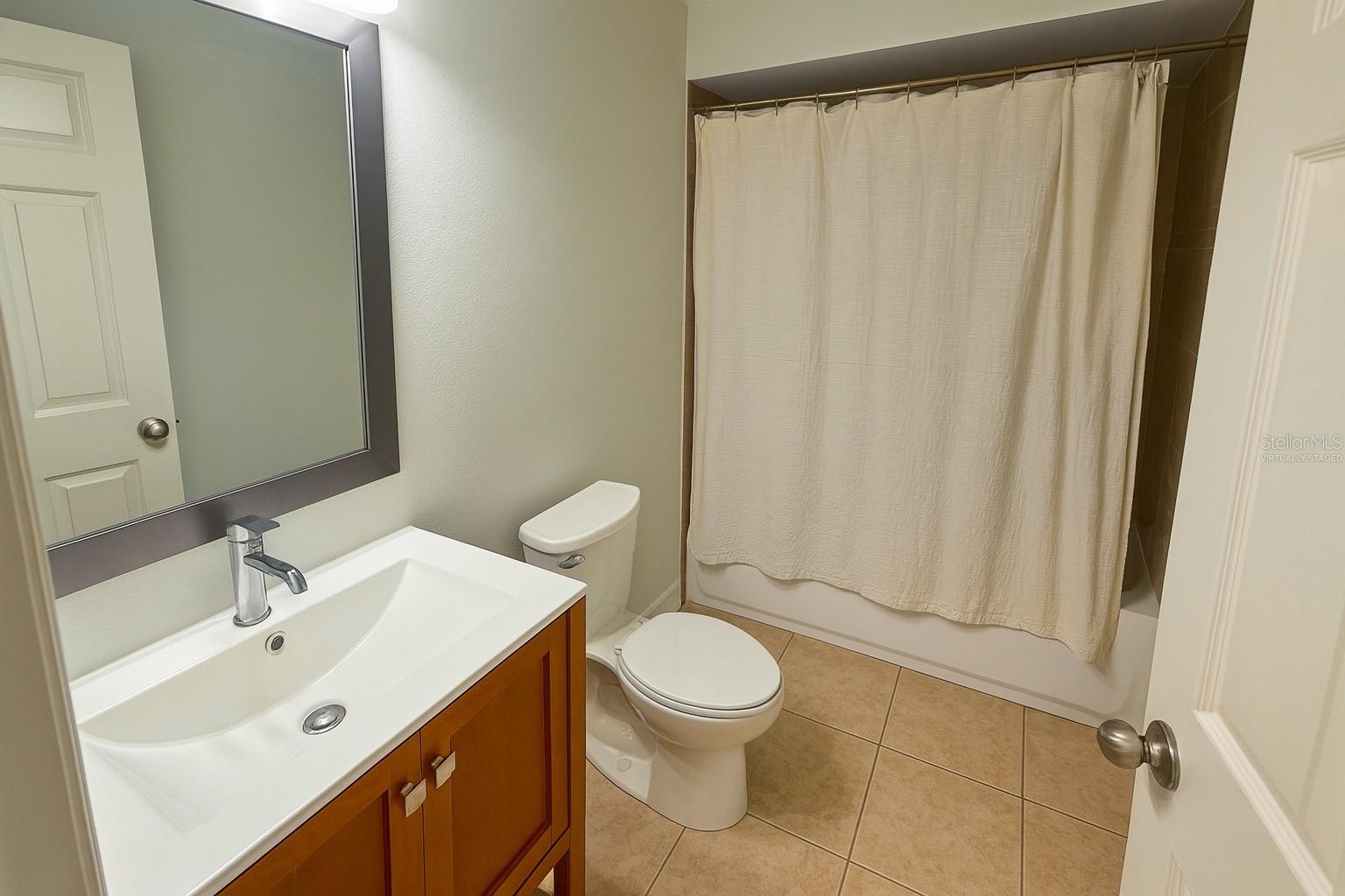 Virtually Staged--Bathroom with tub and shower