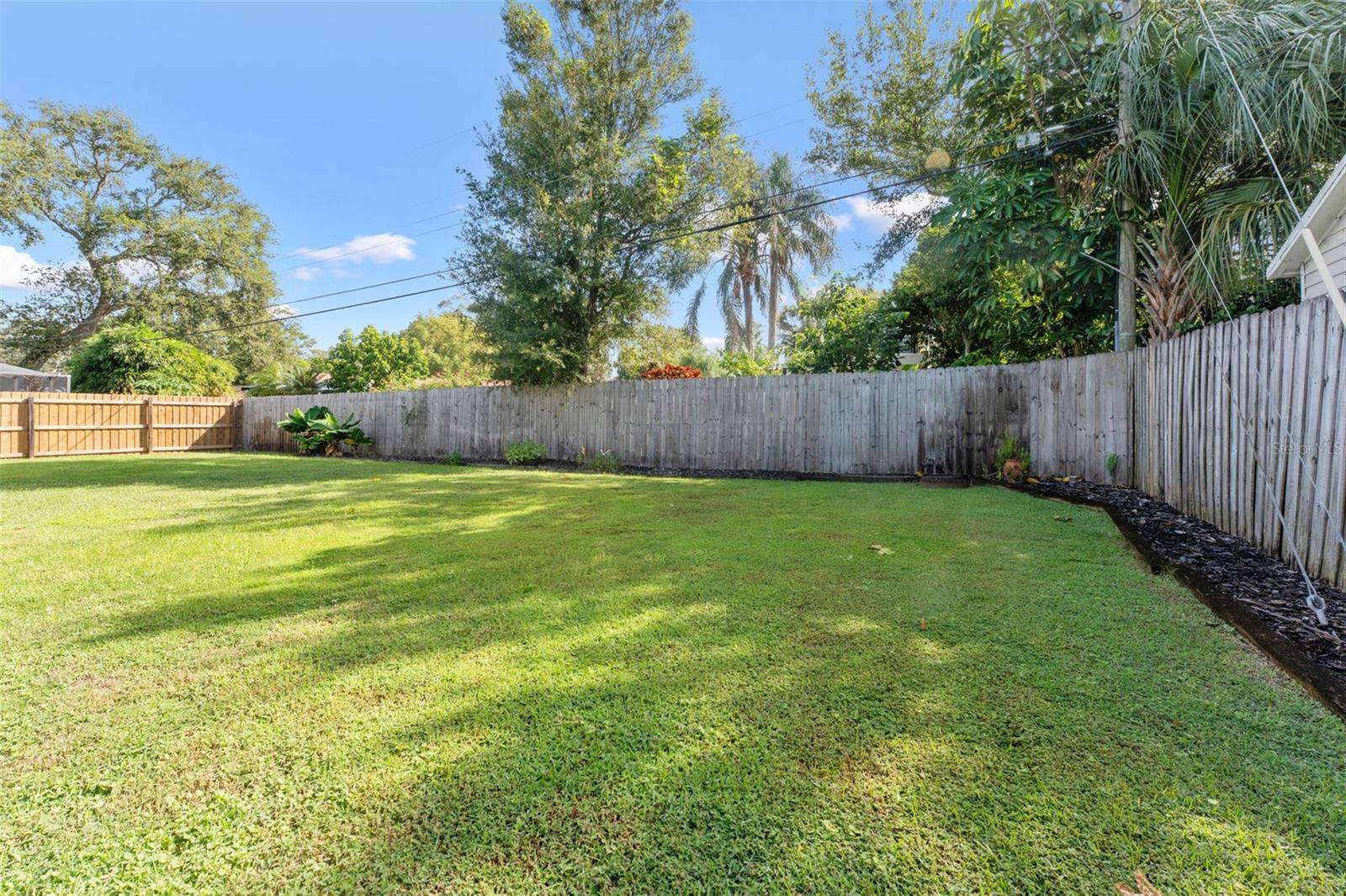 Endless possibilities! The large backyard is perfect for gardening, outdoor entertaining, or creating your own private retreat