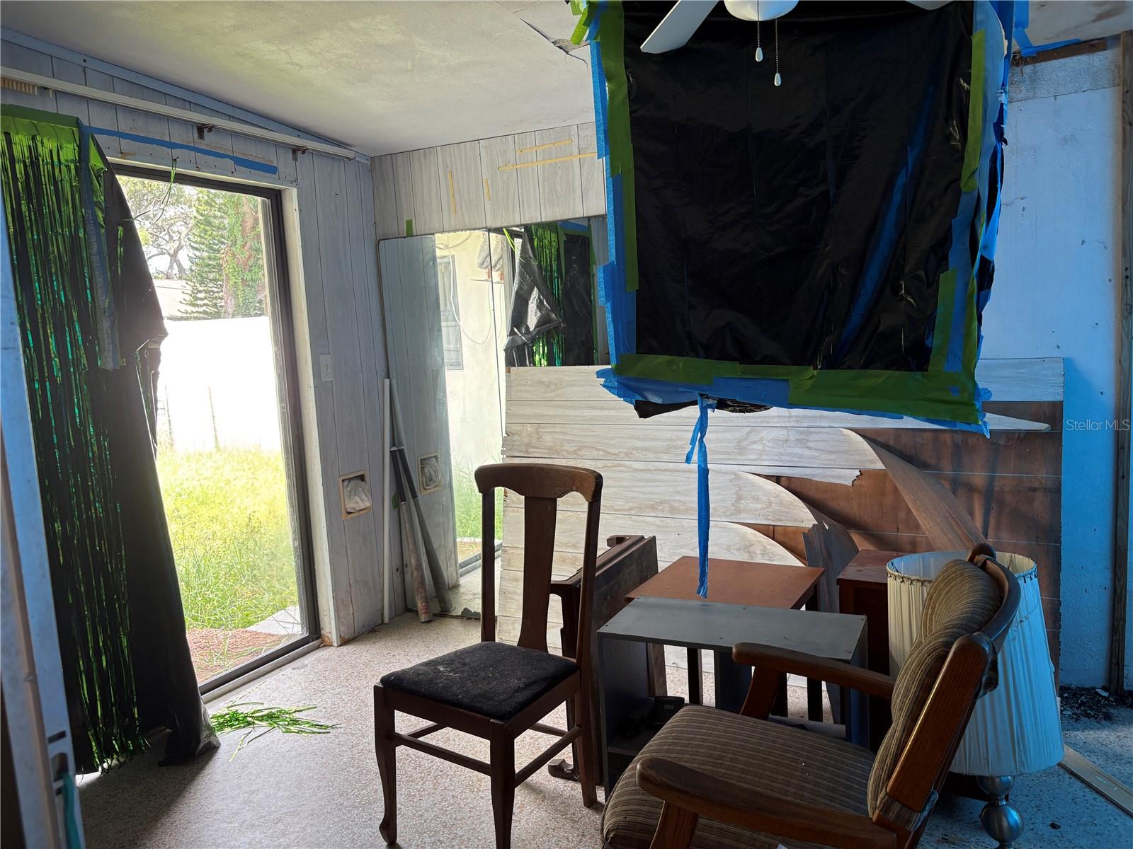 ENCLOSED PATIO-WITH CEILING DAMAGE