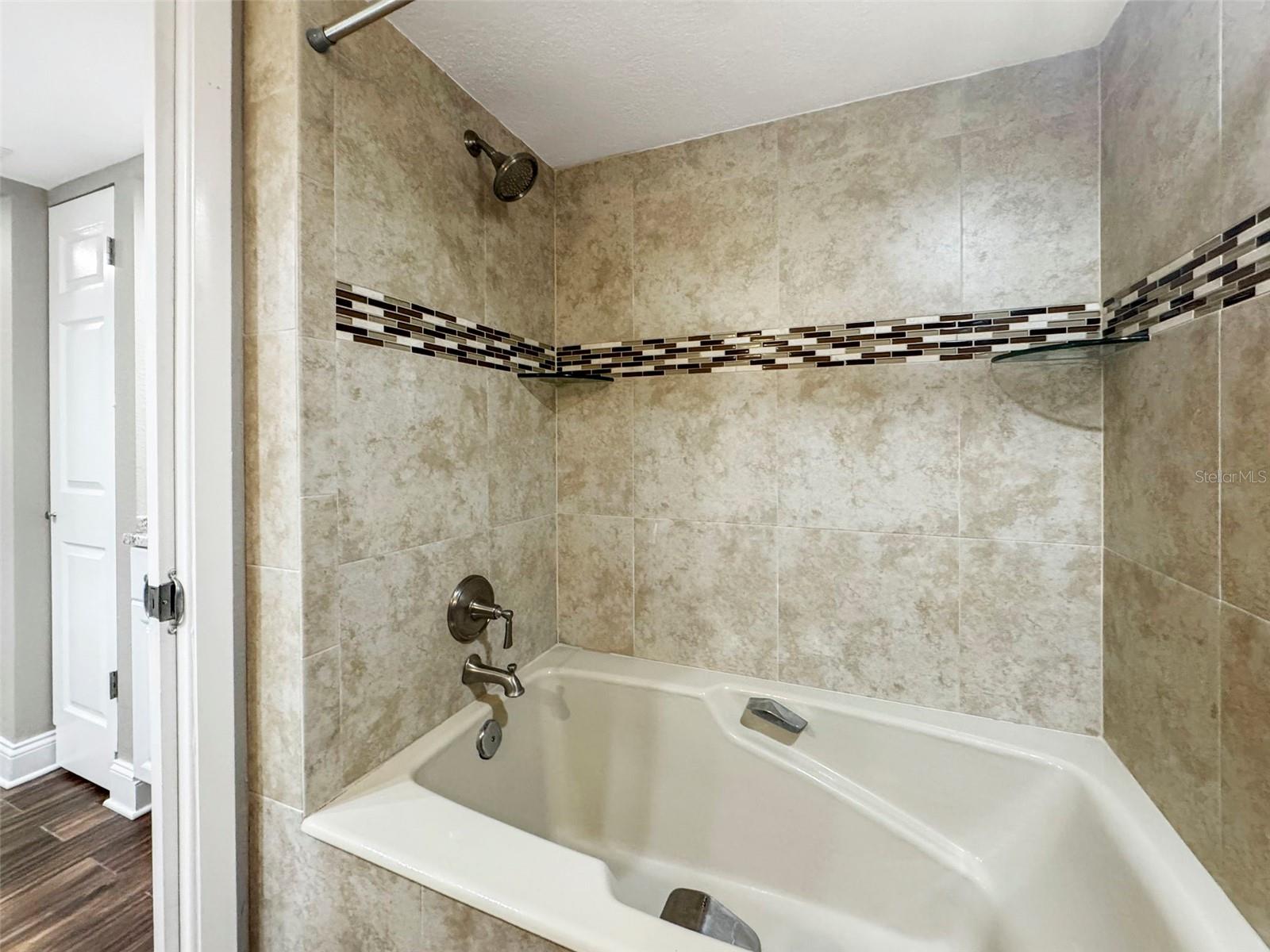 Primary Bathroom With Shower And Tub