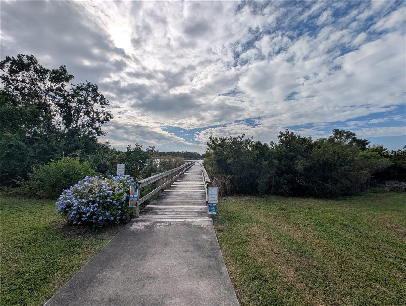 in front of Espana building is the pier leading to Arbor Lake.