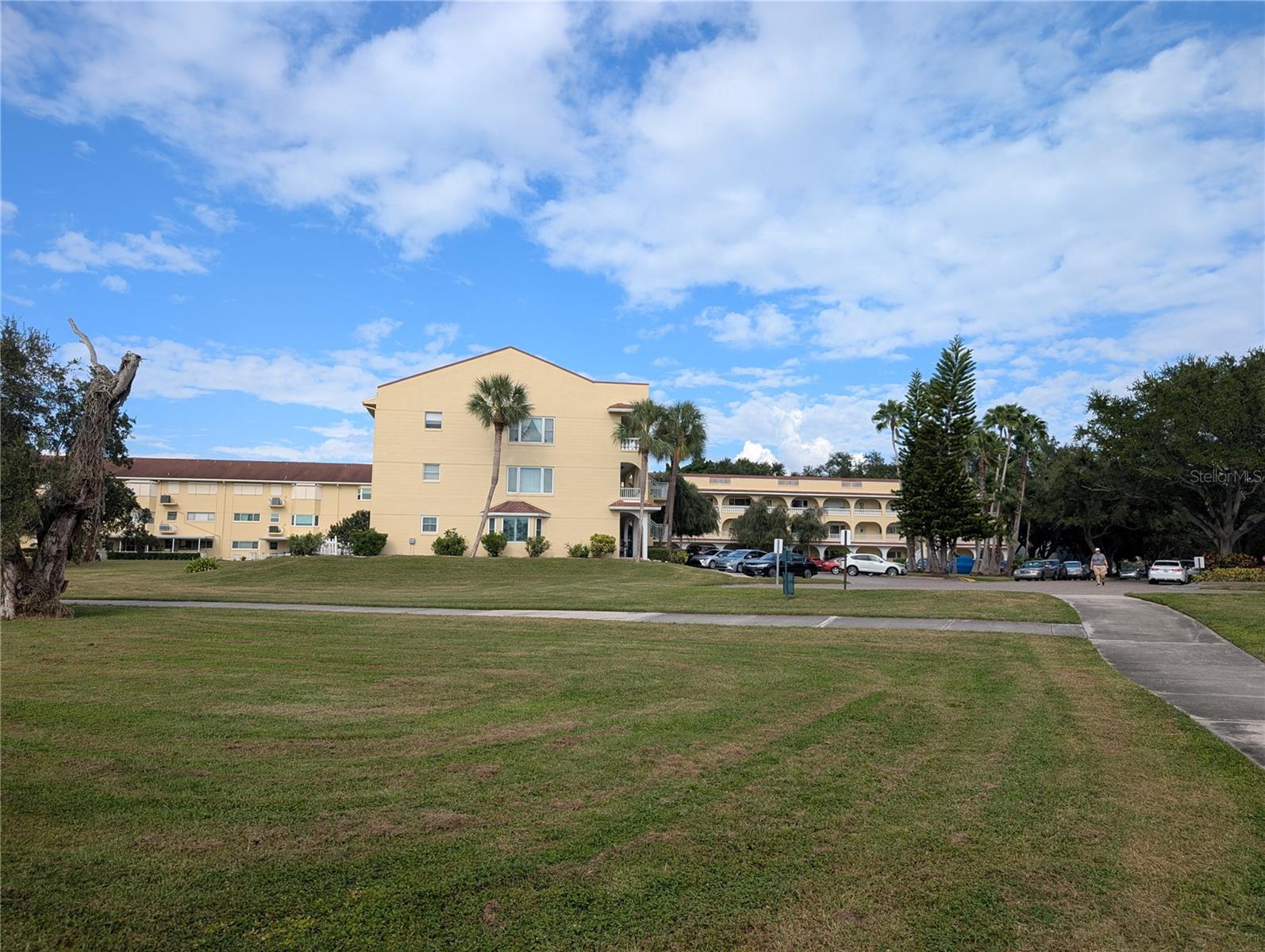 View from lake to Unit #48, located on third floor on left side.