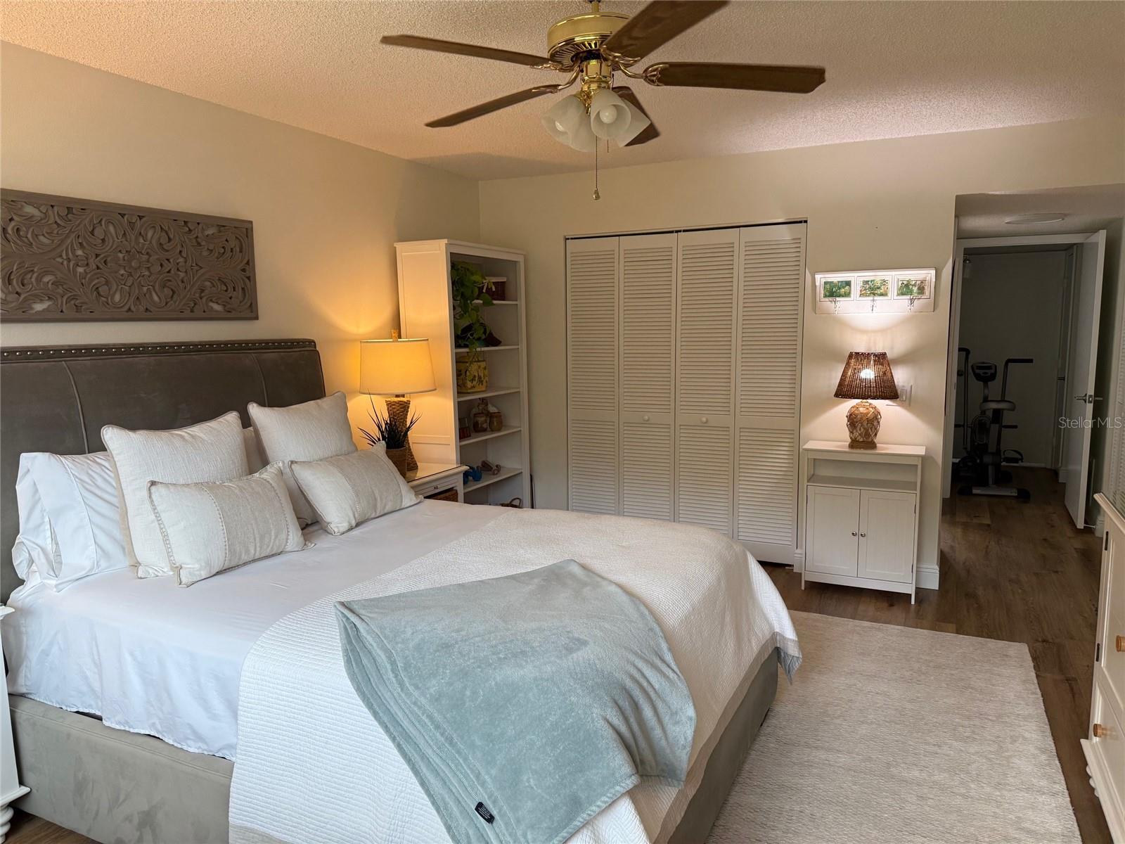 Primary bedroom is spacious enough for a King bed. This is definitely a "Master" suite. Very relaxing, the decor is neutral which pops the luxary vinyl flooring.  There is also an ensuite bathroom and 3 closets.