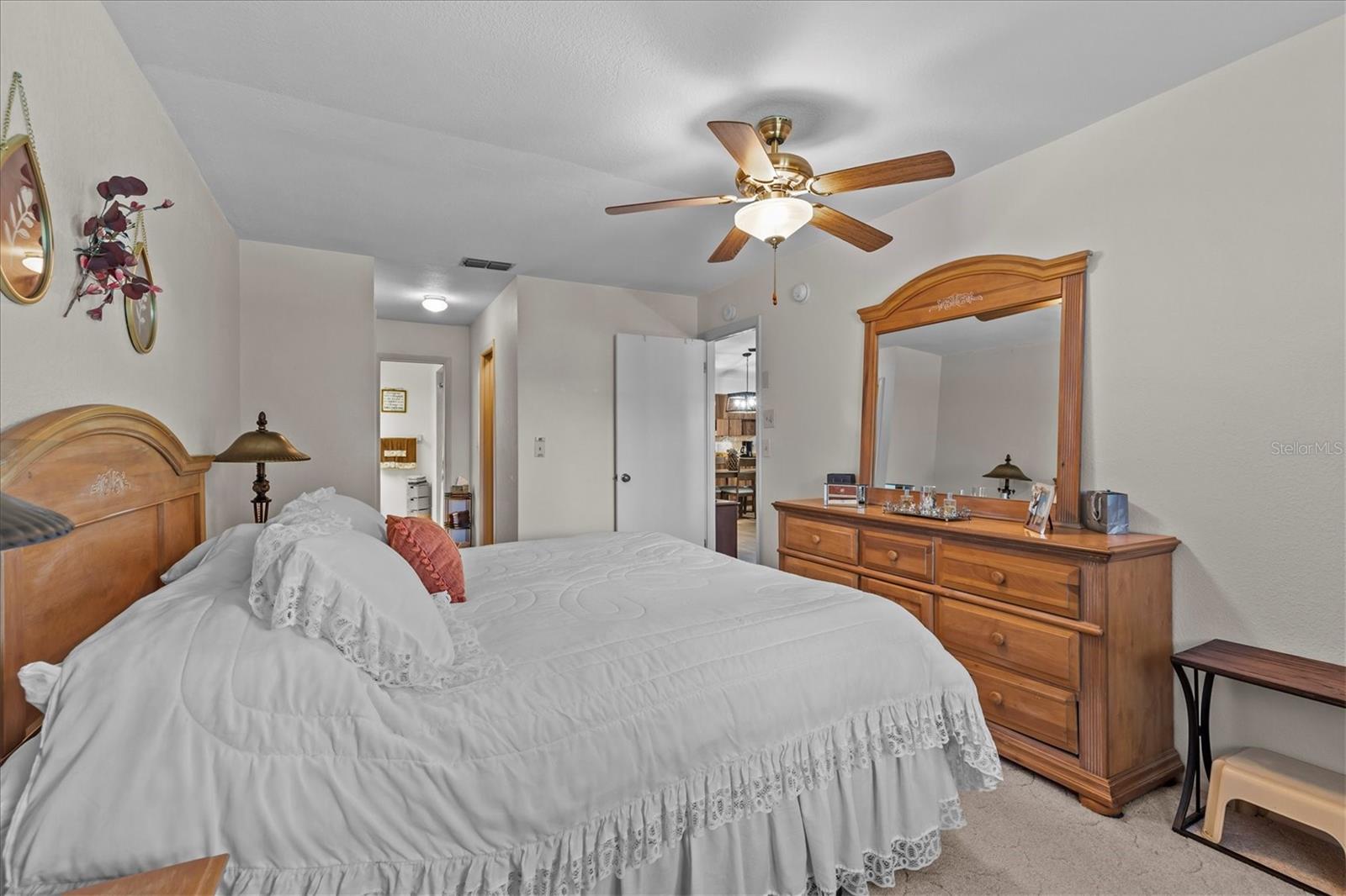 Primary bedroom with bathroom suite