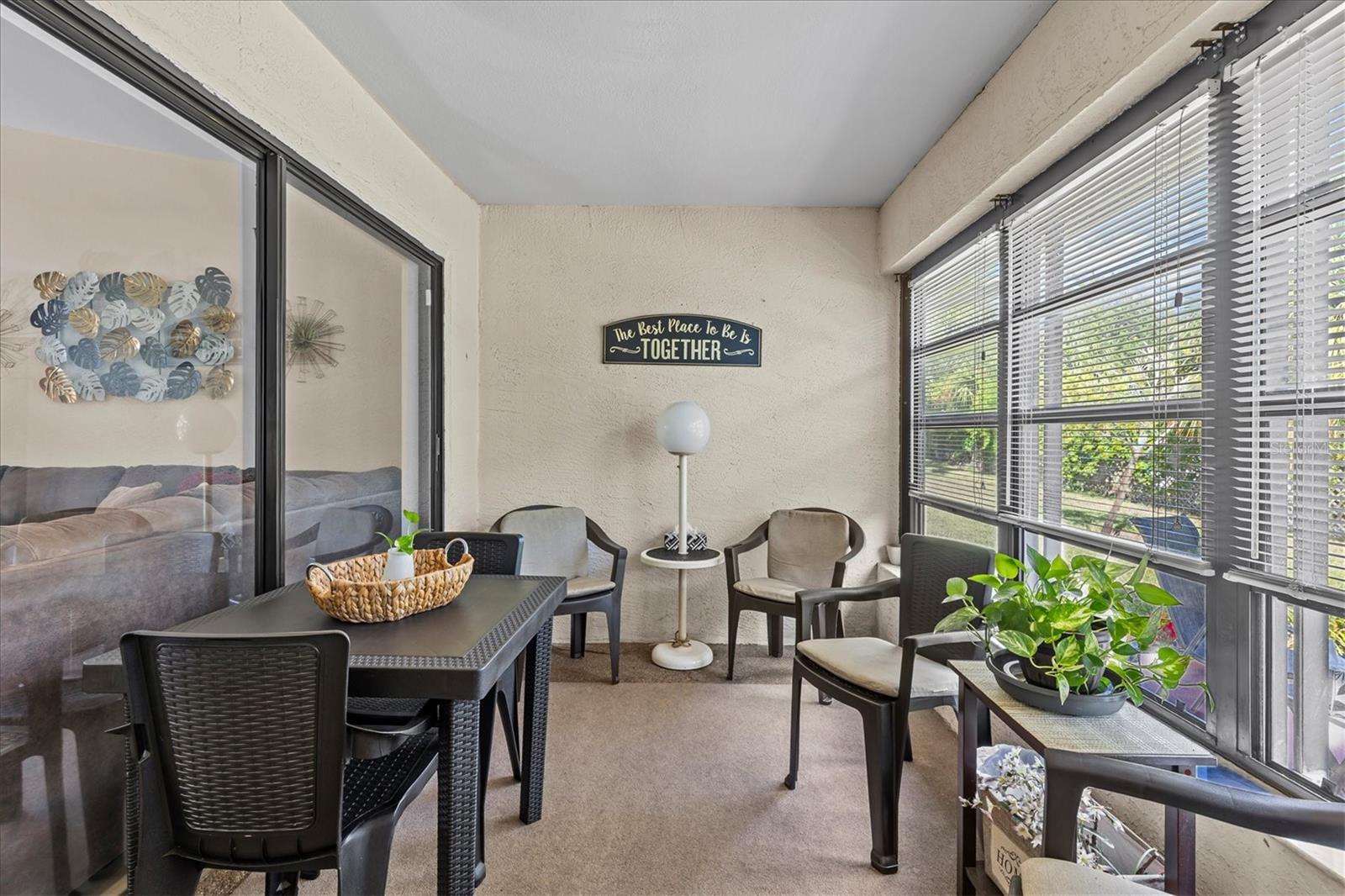 enclosed lanai with windows and remote hurricane shutters