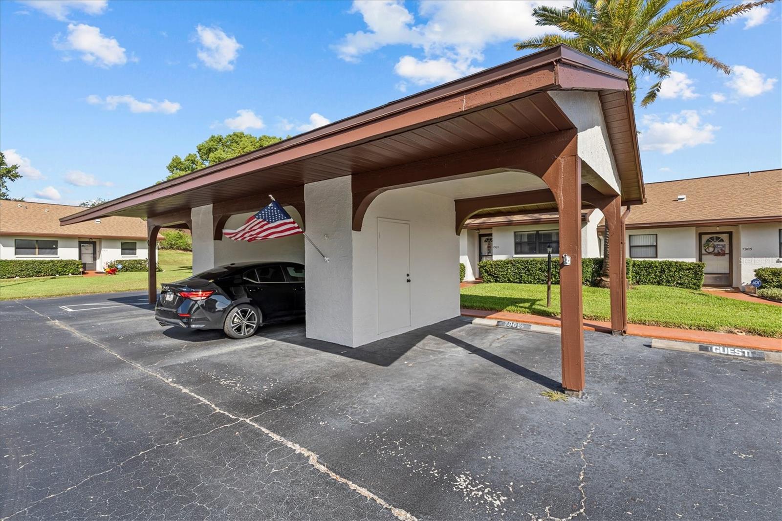 covered parking space with storage closet