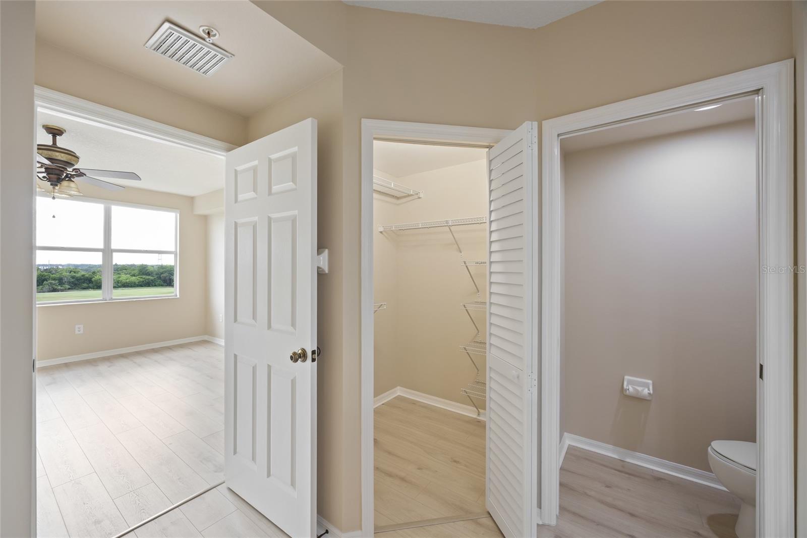 Luxurious Primary En Suite Bathroom with walk in his & hers closets.