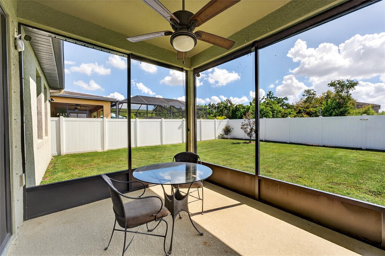 Covered and screened lanai with ceiling fan