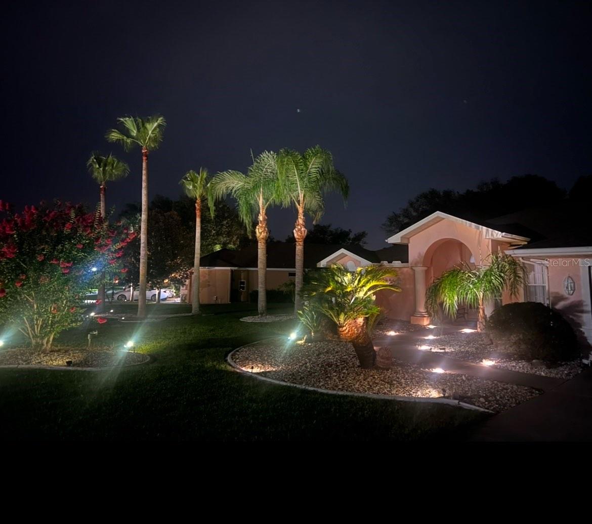 Front at night has lovely accent lighting.  This is a Pristine Place neighborhood tradition which makes this a very nice Florida oasis to live in.