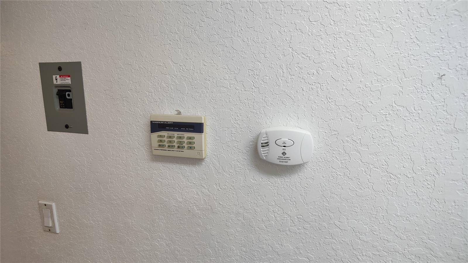 Security system keypad is located in the laundry room which you walk through when entering from the garage.