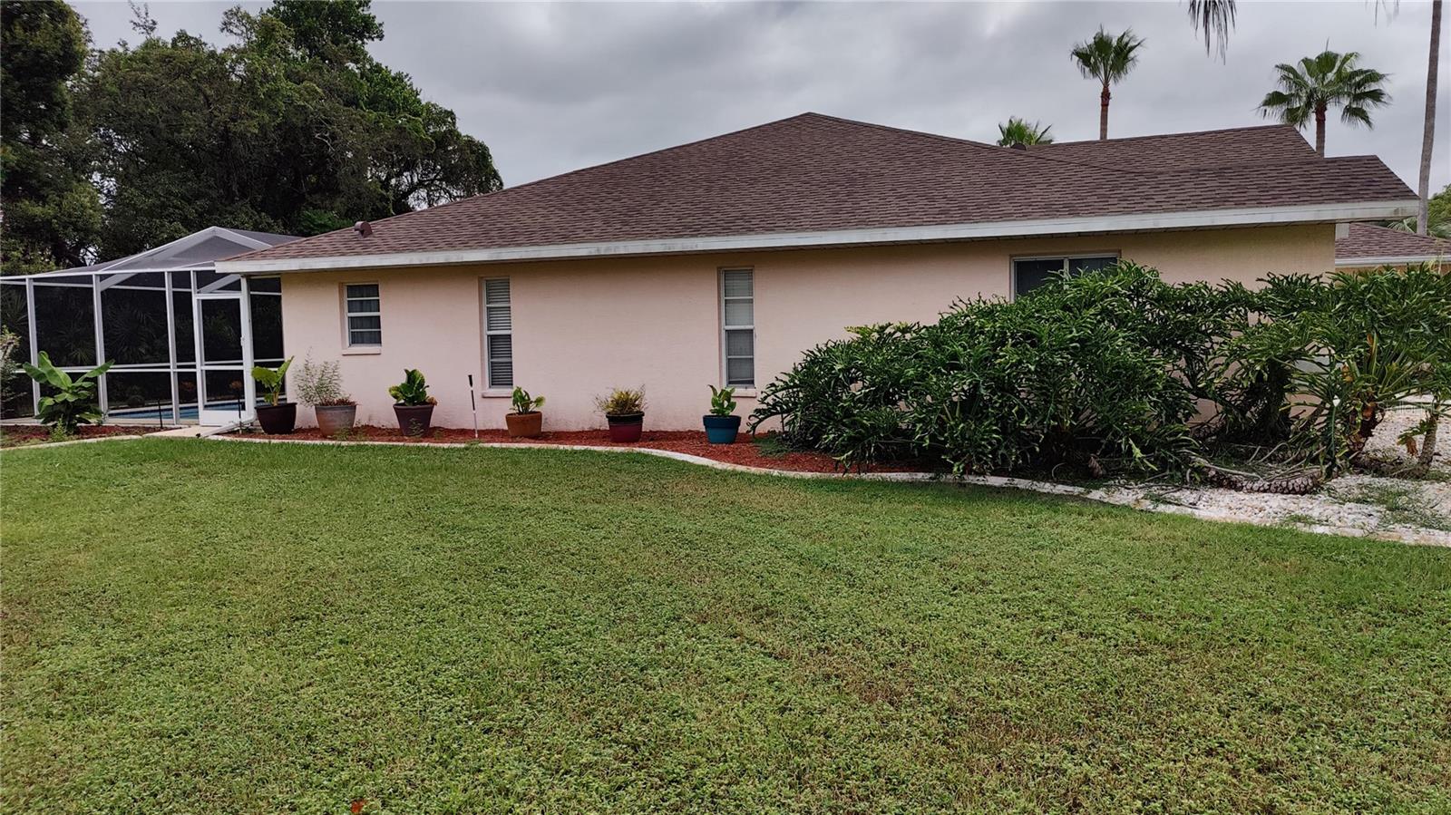 Left side of home and flower garden