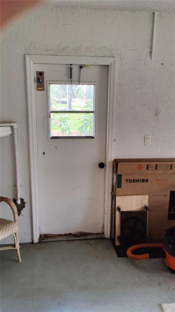 Handy side entrance door to garage even has windows for extra ventilation and light