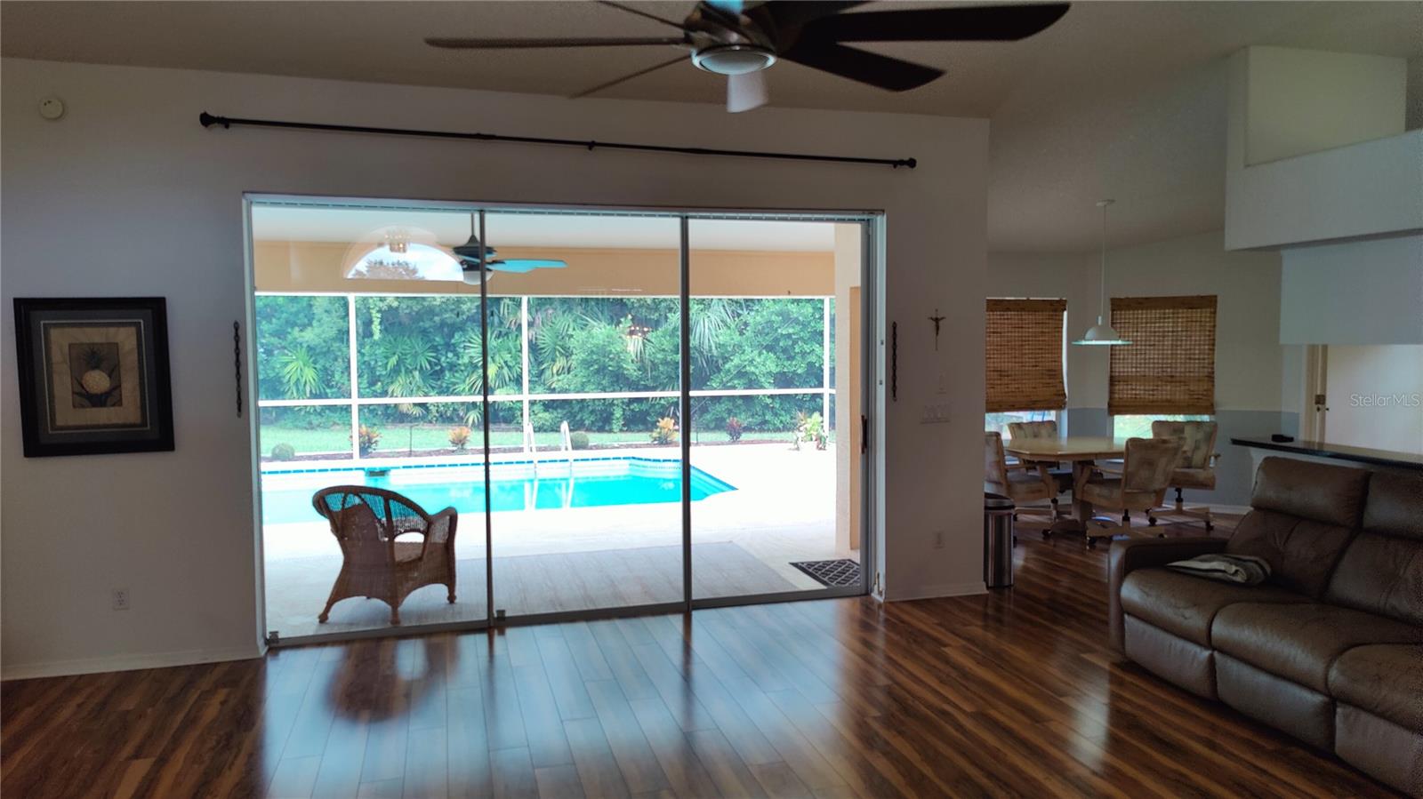 OPEN CONCEPT GREAT ROOM ALLOWS YOU TO SEE STRAIGHT THROUGH THE HOUSE TO THE BACK YARD POOL