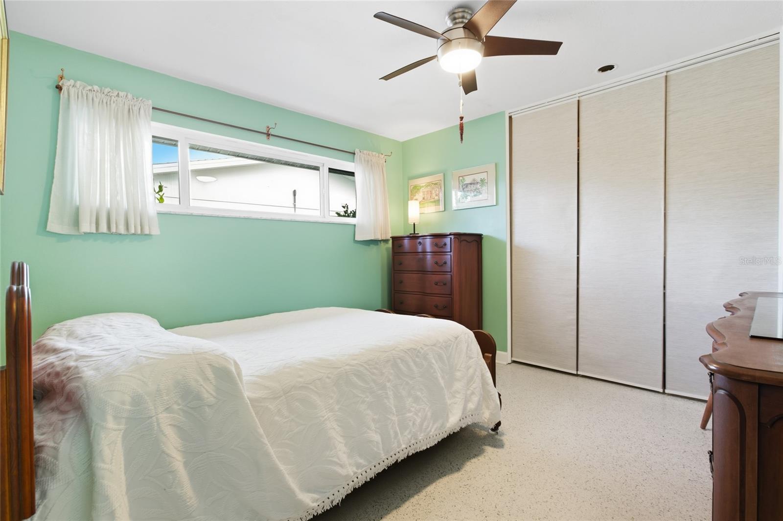 Check out the original terrazzo flooring in this bedroom! This is what is hidden under the tile!