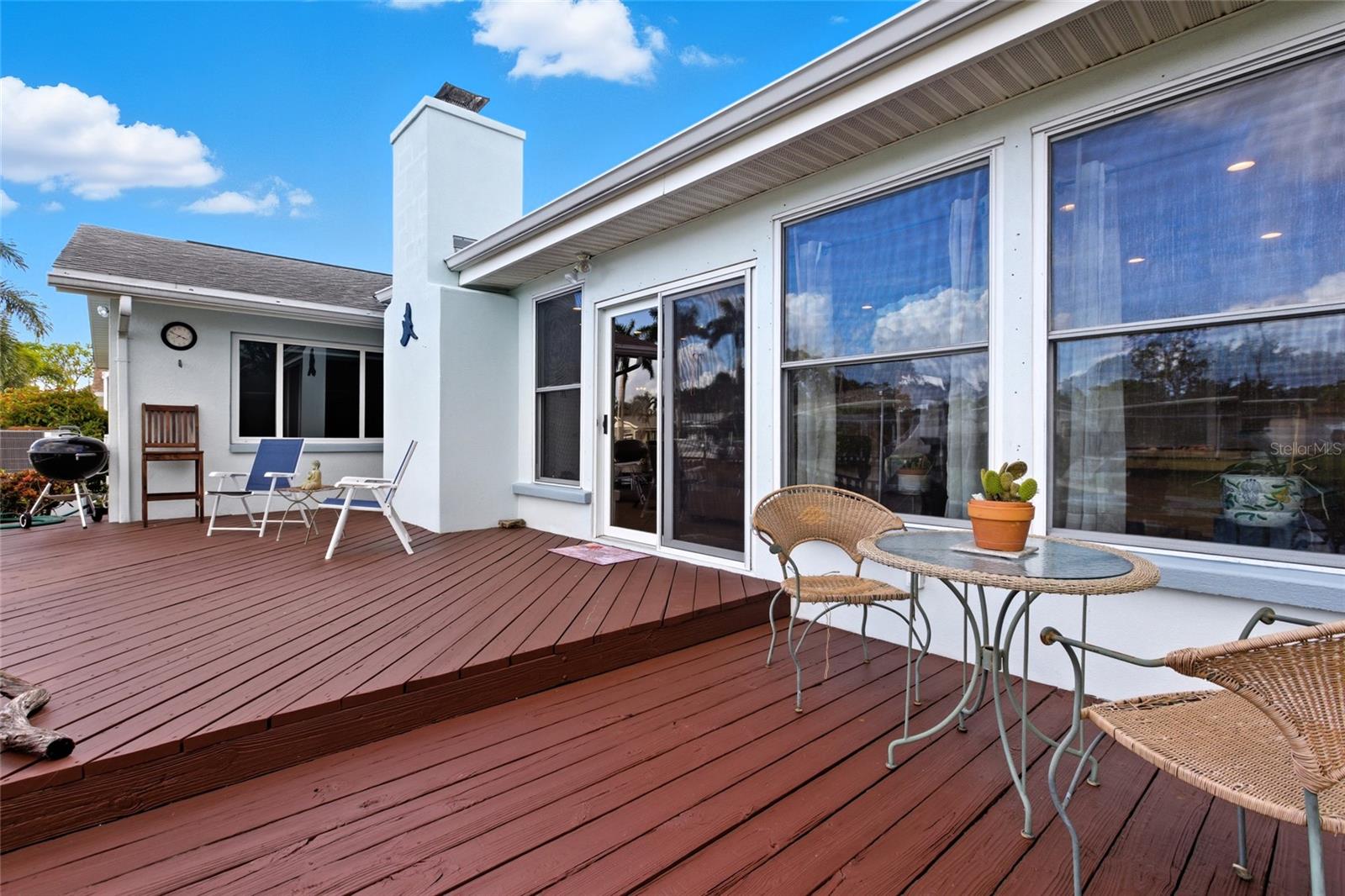 An expansive deck offers lots of room to entertain and then jump on the boat!