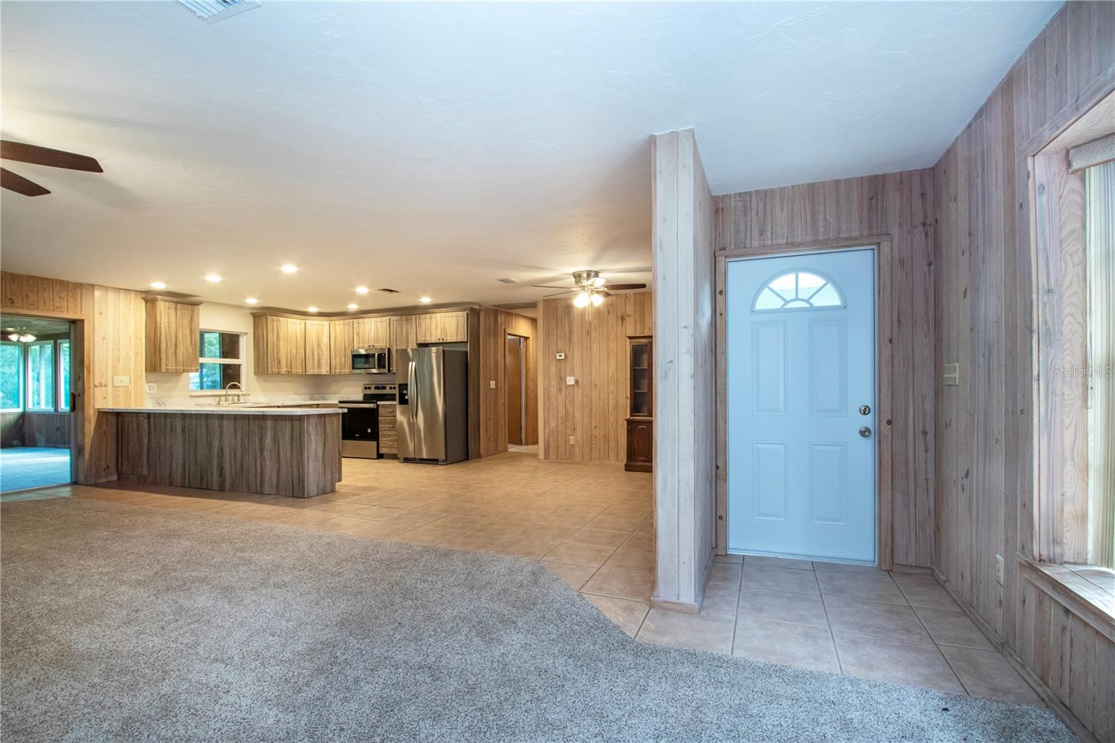 Turn Key entry with new carpet kitchen cabinets and stainless appliances and light fixtures