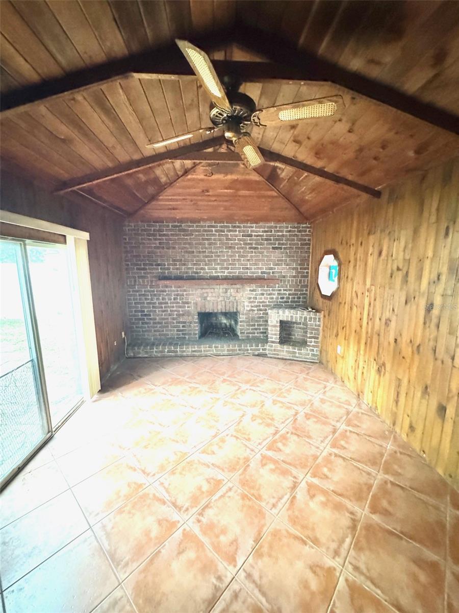 Family room with wood burning fireplace