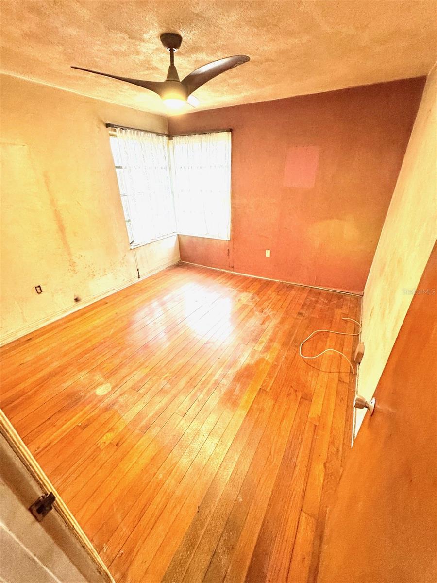 Primary bedroom has solid oak flooring
