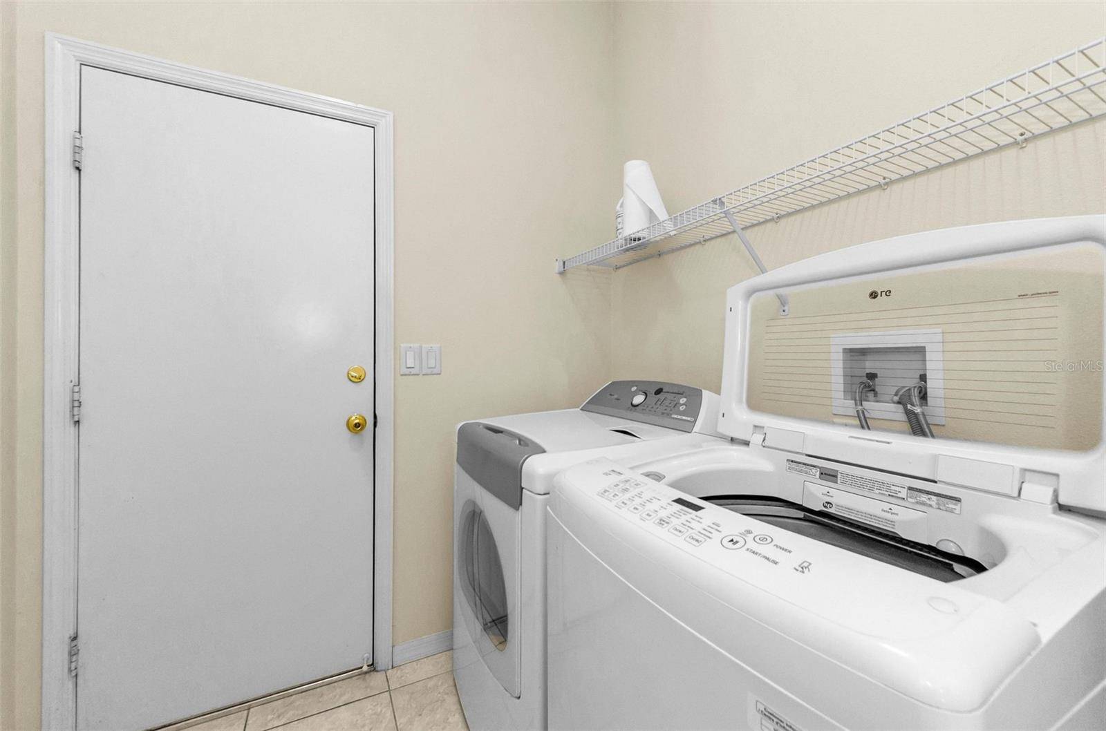 Laundry Room with door leading into garage