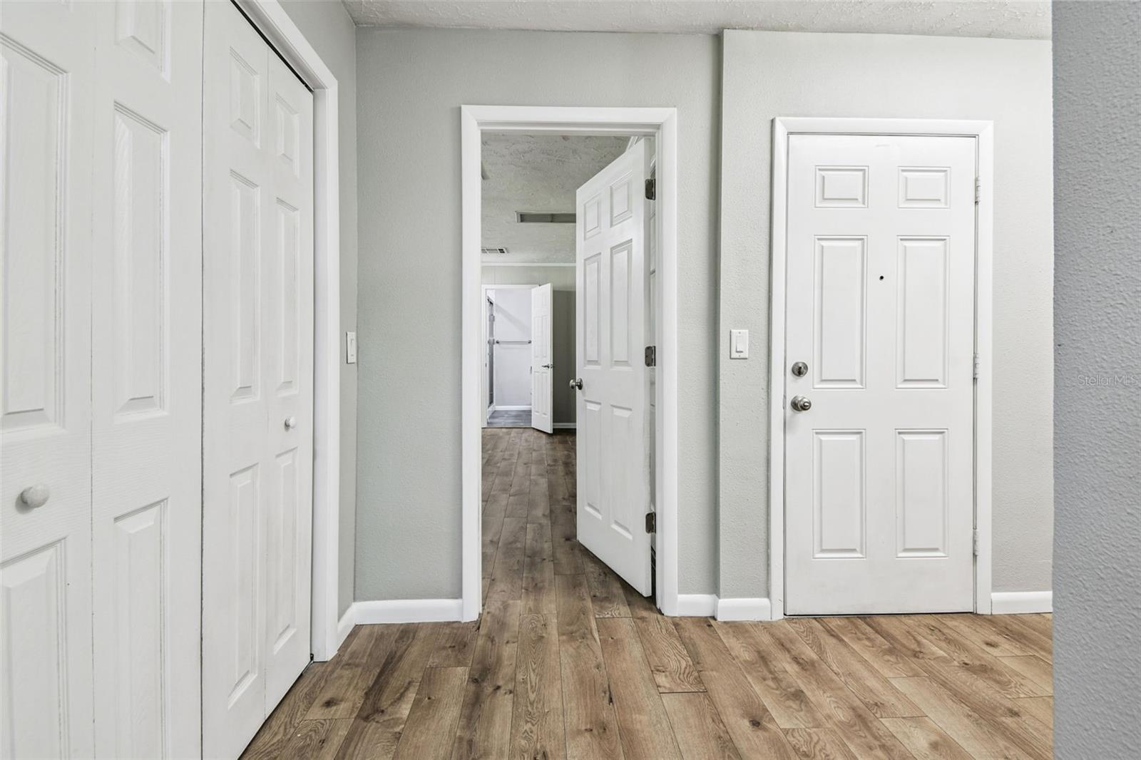 Hall and entrance to second ensuite. Pantry and garage exit.