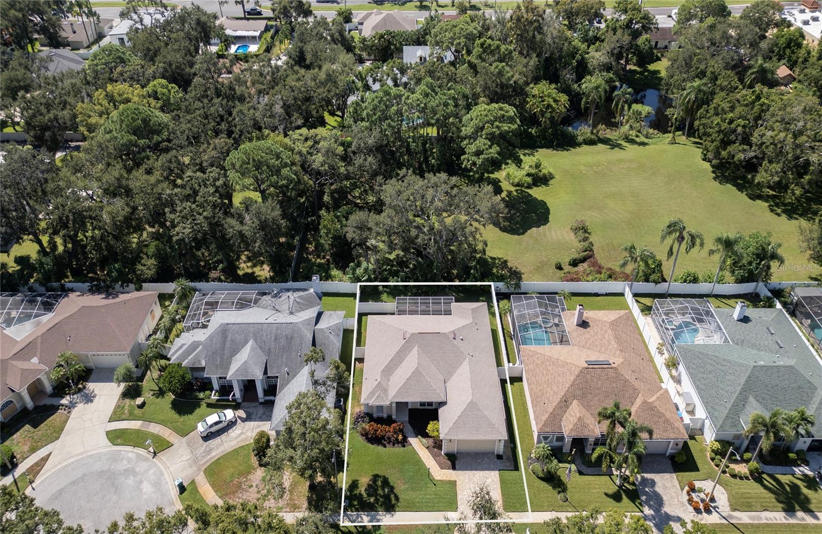 Near end of cul-de-sac, and HOA owns treed parcel south of Oak Run Court