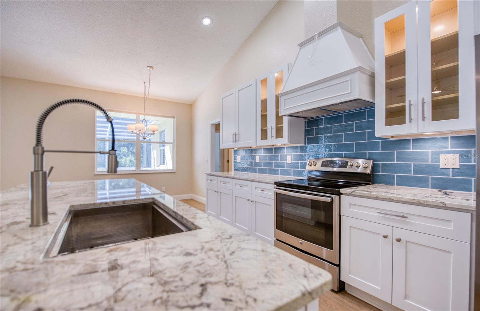 Multiple work surfaces in beautifully updated kitchen
