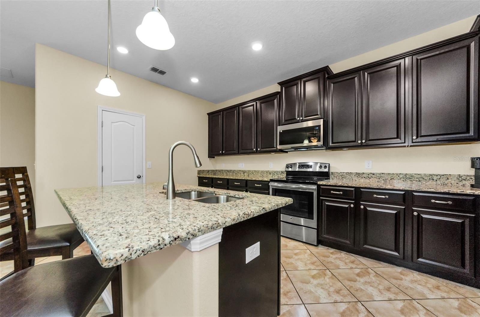 TONS OF CABINETS WITH A WALK IN PANTRY