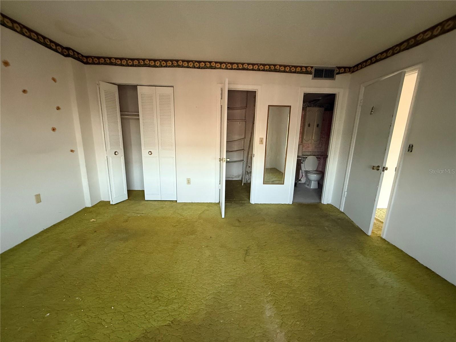 Primary Bedroom with His/Hers Closets
