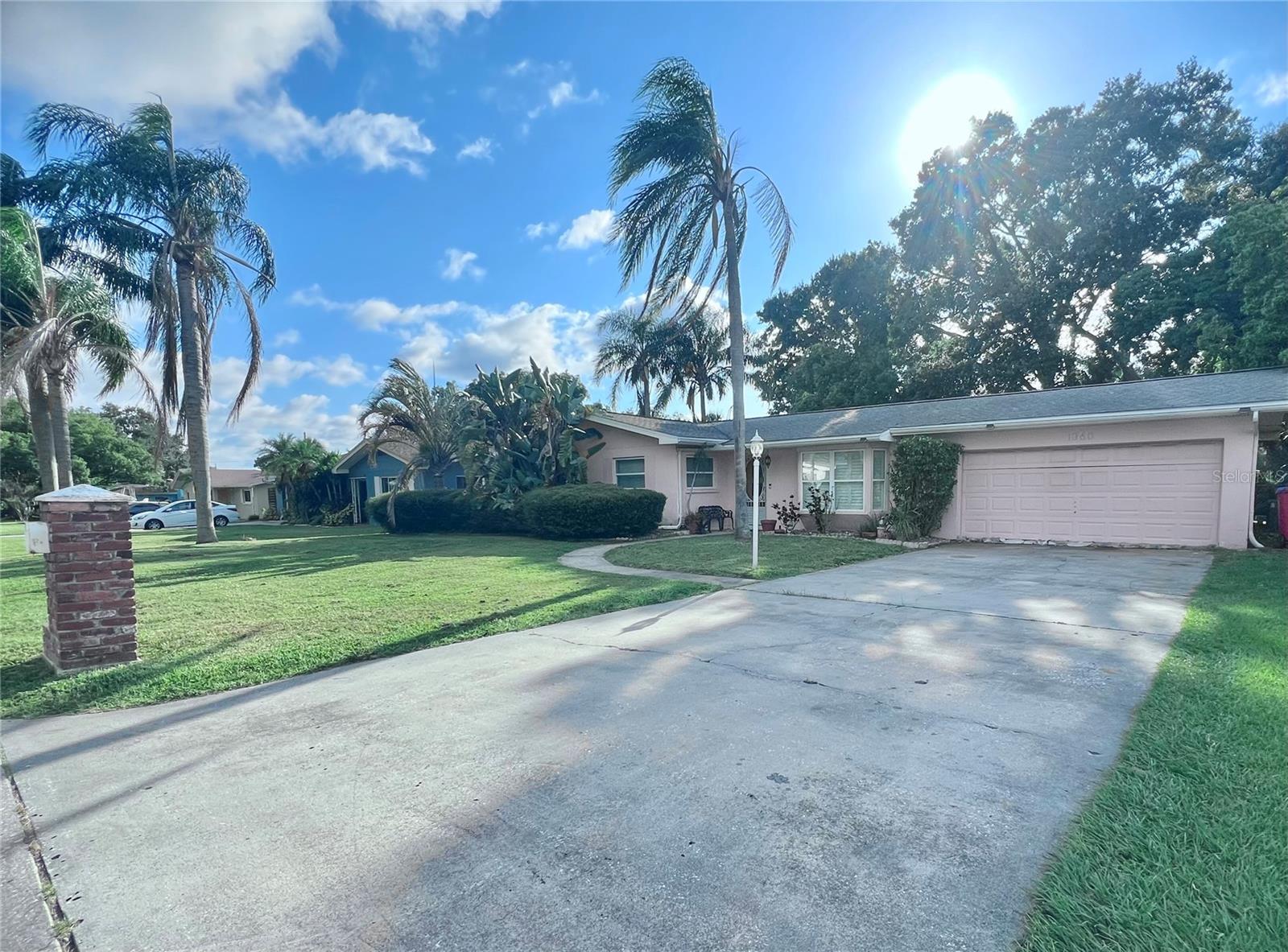 Front of home with large driveway