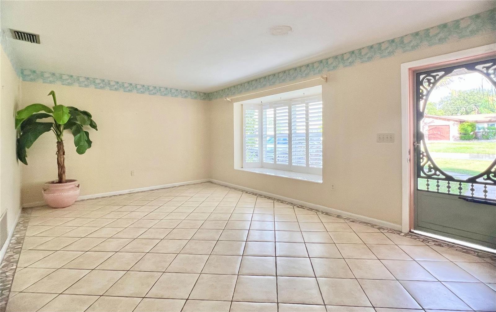 Front living room with Bay window and inside shutters