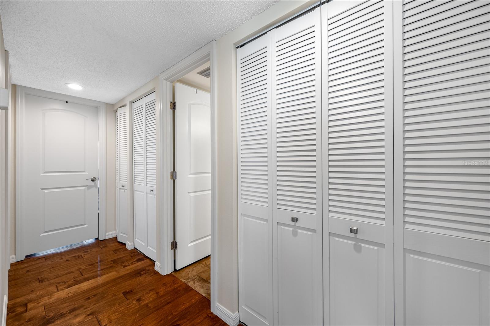 Hallway leading to bedrooms and 2nd bathroom