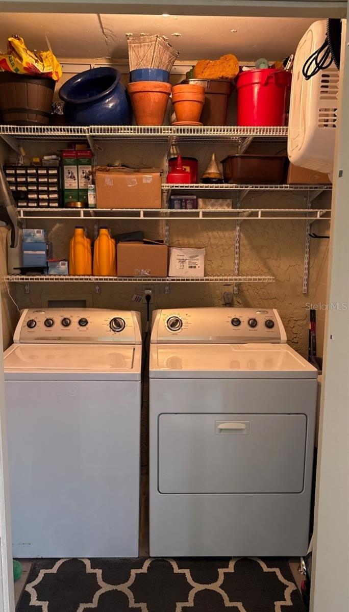 Laundry with full size washer and dryer.  Located off 2nd lanai, nearby to the primary bedroom