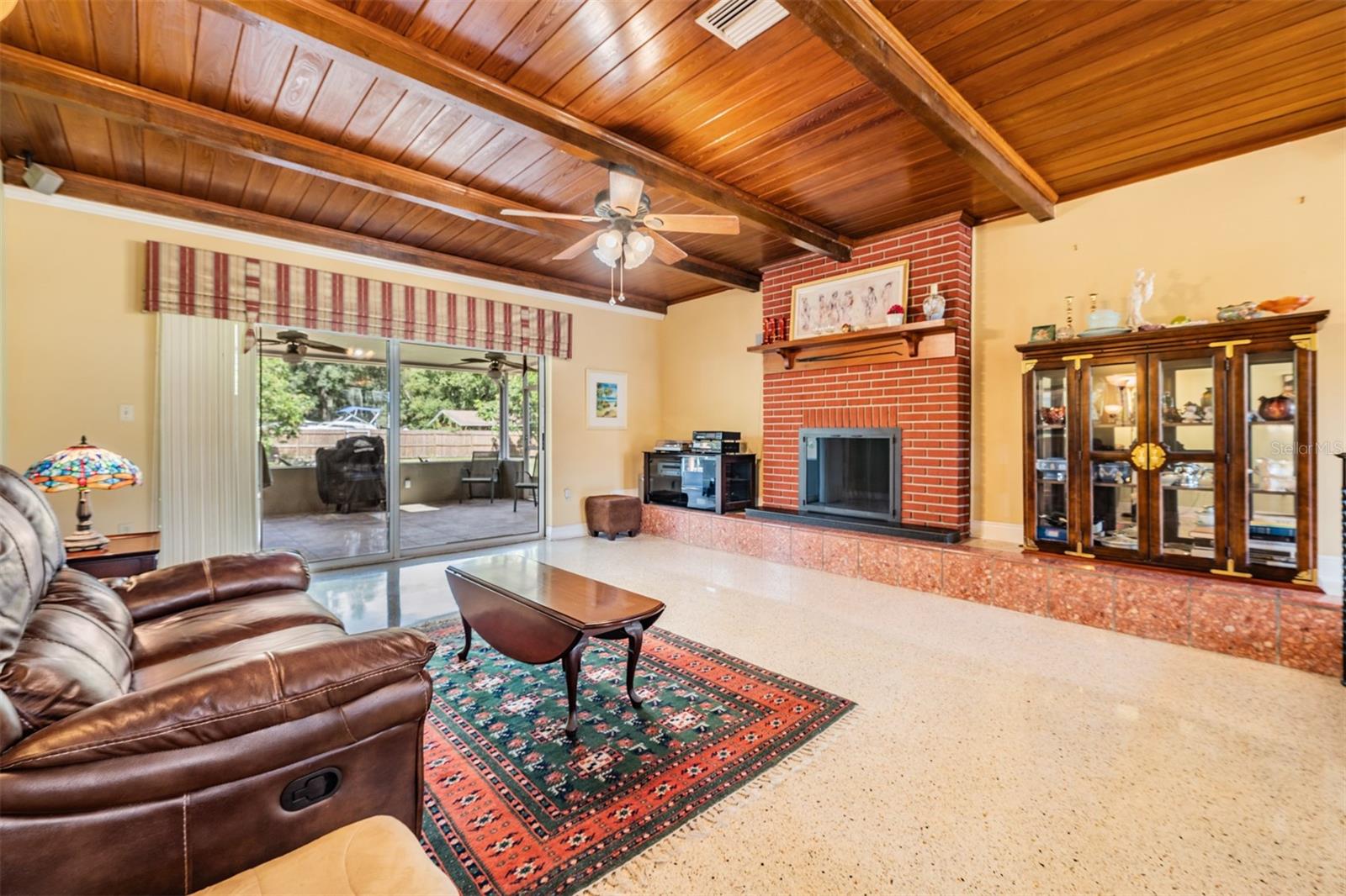 Family room with fireplace and wood ceiling