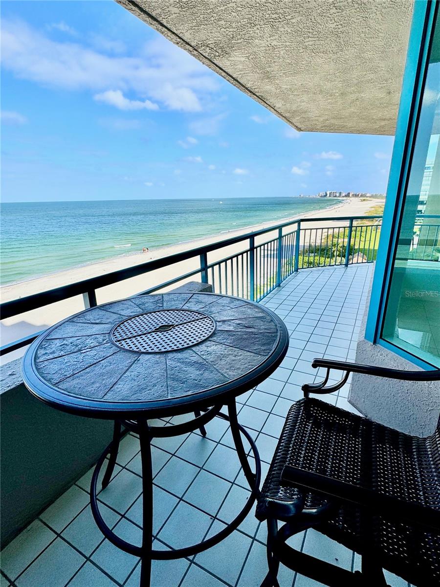 Huge balcony with a private nook and beach front views!