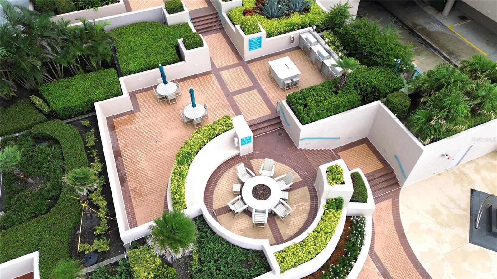 Community fire pit, loungers, and 3 BBQ areas