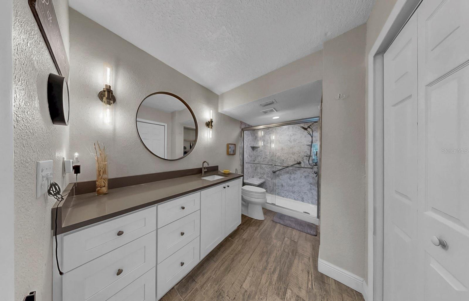 Primary bathroom with new walk-in shower