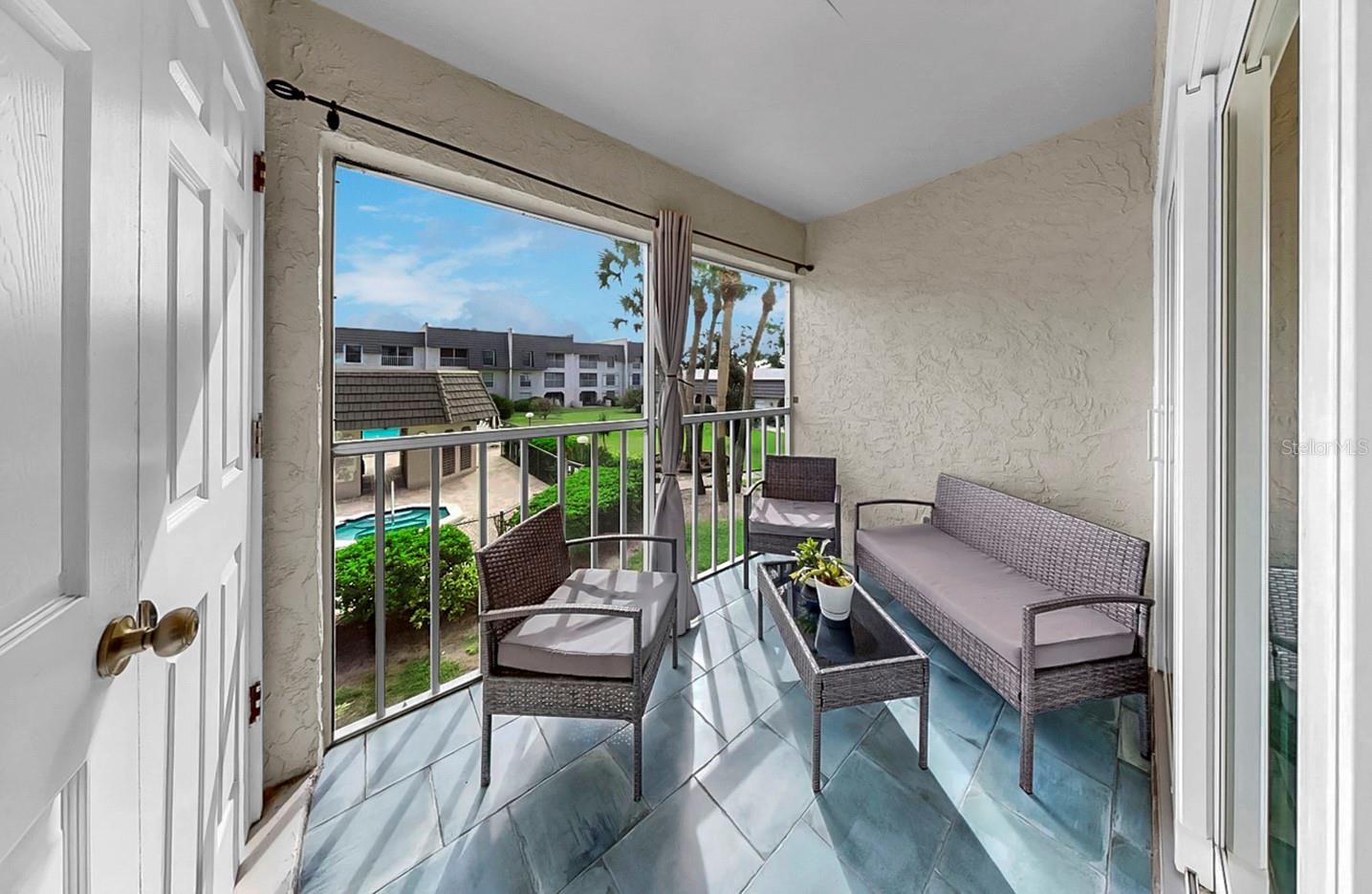 Porch overlooking pool area.