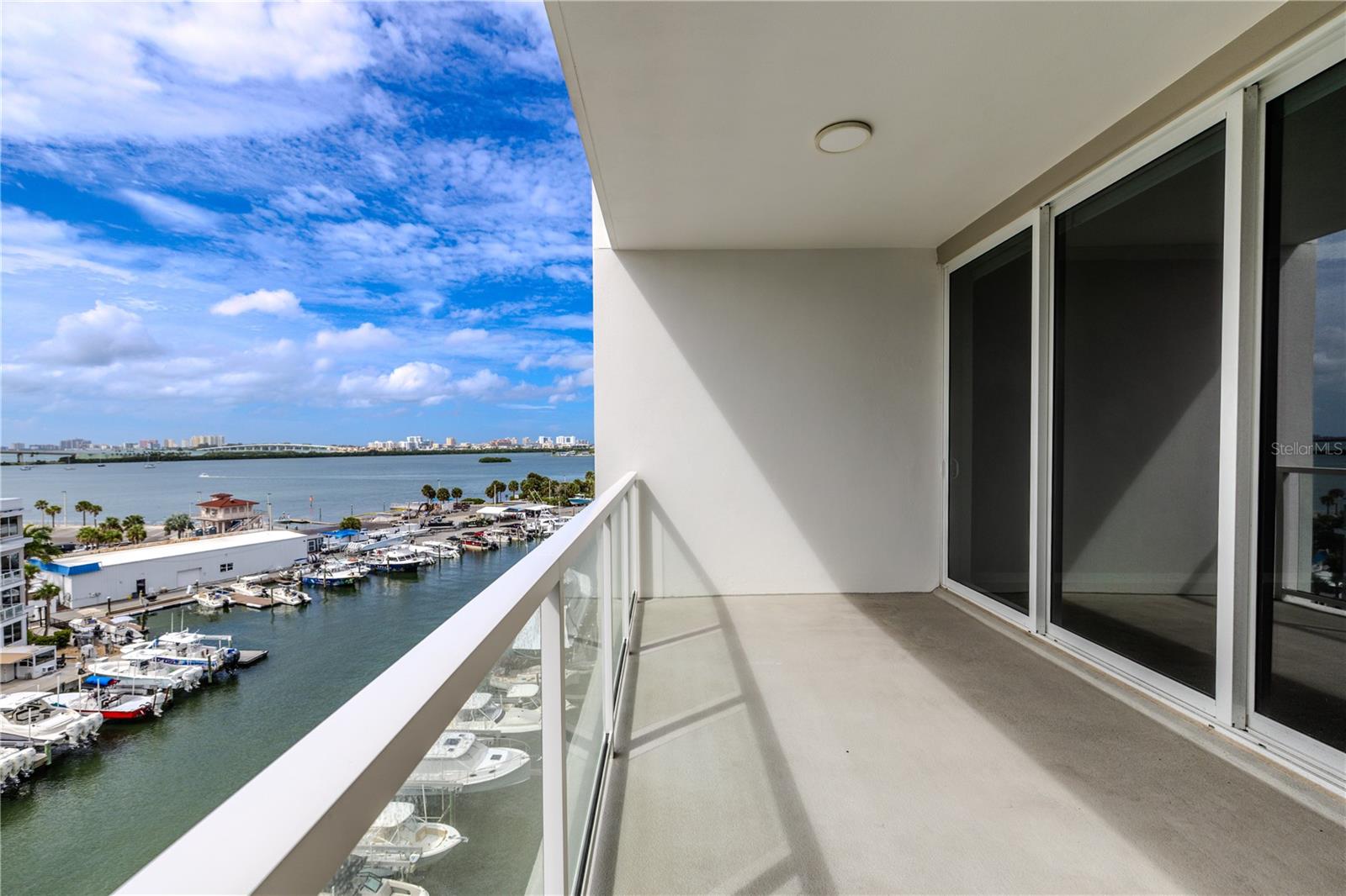 From your private balcony, take in the sights of passing boats, lush waterfront residences, and the stunning skyline beyond—all while basking in the warm Gulf breeze.